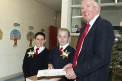 Lt. Col Gerry O\'Gorman (Rtd) is greeted by David Rogan and Claudia Murray -two school ambassadors from 6h class - as he arrives at St. Anne\'s School, Ardclough for the Presentation of the National Flag and 1916 Proclamation to the school.